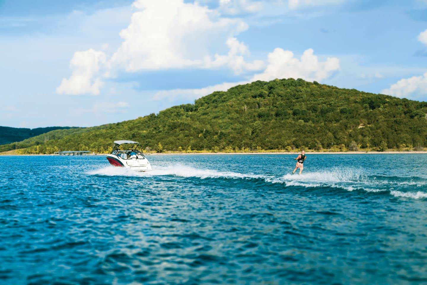 Adults overseeing children on boat ride